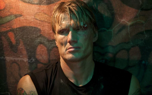 Dolph Lundgren as Gunnar Jensen in a dramatic moment from the movie The Expendables, featuring intense lighting against a textured background. 4K Ultra HD wallpaper.