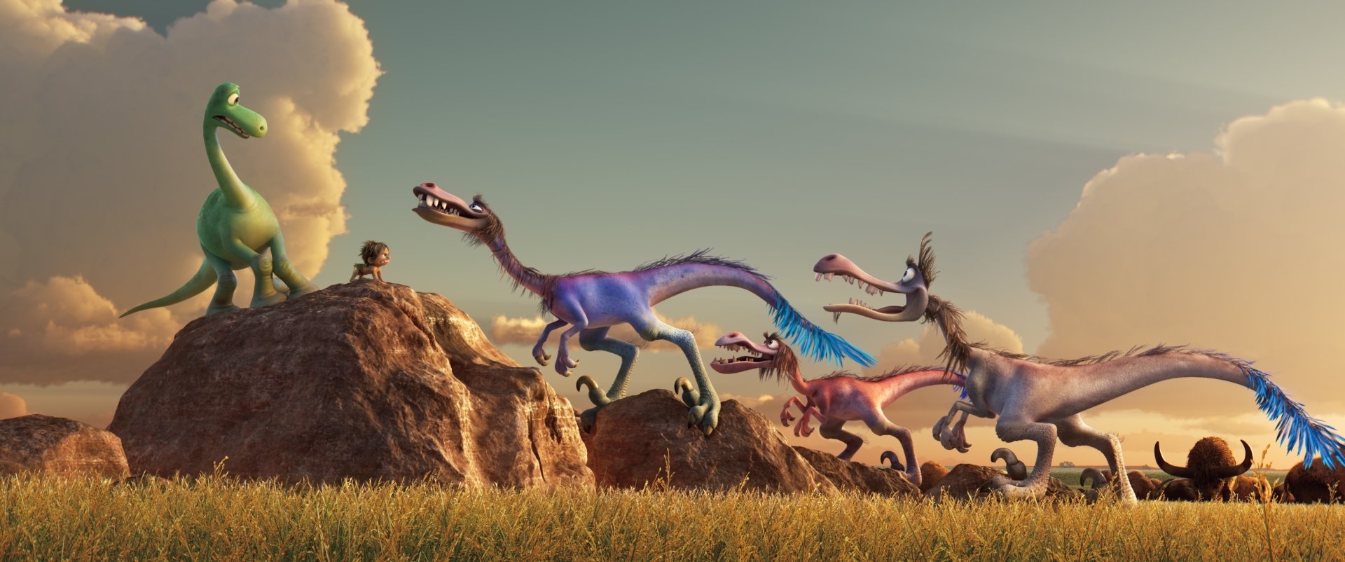 HD desktop wallpaper of Pixar's The Good Dinosaur, featuring characters Spot and Arlo facing off against a group of colorful dinosaurs under a bright sky.