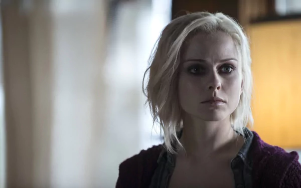 Rose McIver as Liv Moore from the TV show iZombie in a 4K Ultra HD desktop wallpaper, showcasing her intense expression in a dimly lit setting.