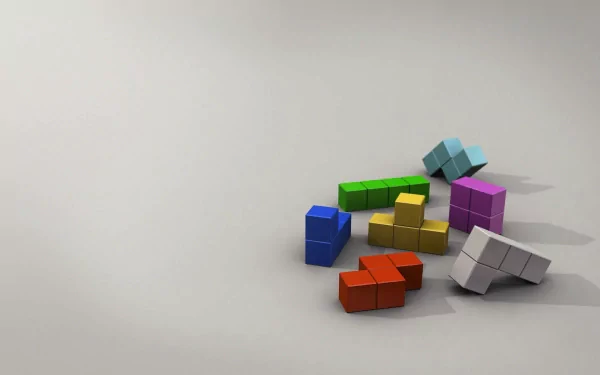 HD PC desktop wallpaper featuring colorful Tetris blocks scattered on a light background, representing the classic video game.