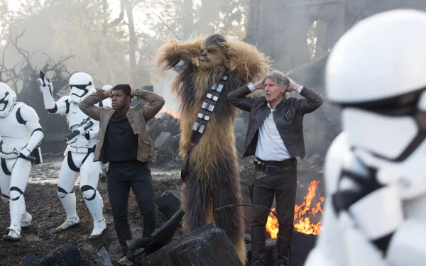 A scene from Star Wars Episode VII: The Force Awakens featuring Han Solo, Finn, and Chewbacca amidst chaos, surrounded by stormtroopers. 4K Ultra HD wallpaper capturing the action.