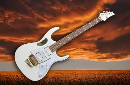White electric guitar against a golden field and dramatic orange sky — HD PC desktop wallpaper background celebrating music and the instrument.