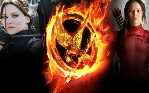 HD PC desktop wallpaper featuring Jennifer Lawrence as Katniss Everdeen from The Hunger Games: Mockingjay - Part 2 with the iconic flaming mockingjay emblem.