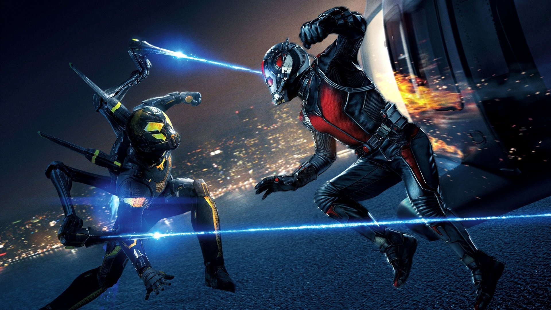 HD PC desktop wallpaper depicting an intense Ant-Man movie fight scene with two armored characters clashing on a rooftop at night.
