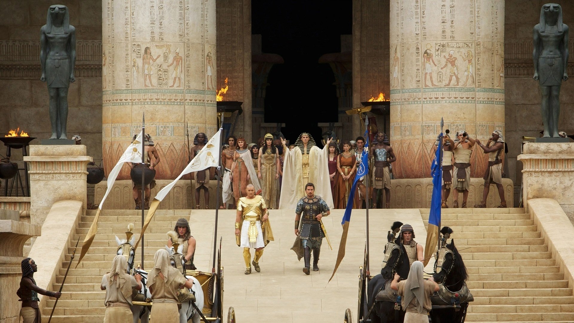 HD PC desktop wallpaper featuring a grand scene from the movie Exodus: Gods and Kings, showcasing ancient Egyptian architecture and characters in period costumes.