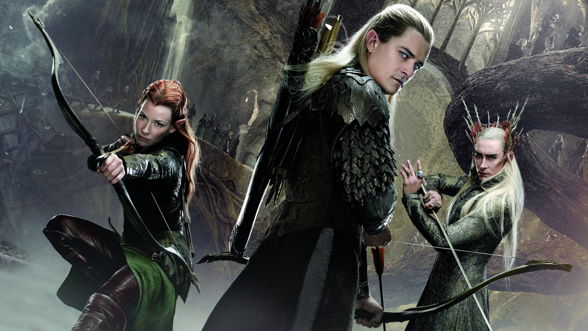 HD PC desktop wallpaper showing three elven archers poised with bows in a misty forest, from the movie The Hobbit: The Desolation of Smaug.