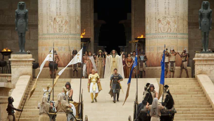 HD PC desktop wallpaper featuring a grand scene from the movie Exodus: Gods and Kings, showcasing ancient Egyptian architecture and characters in period costumes.
