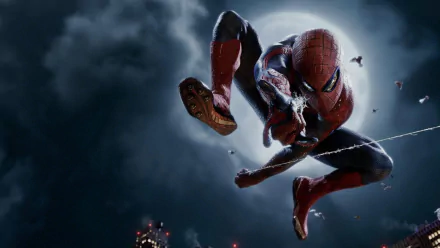 A dramatic HD wallpaper featuring Spider-Man in action, showcasing his iconic pose against a moonlit sky, inspired by the movie The Amazing Spider-Man.