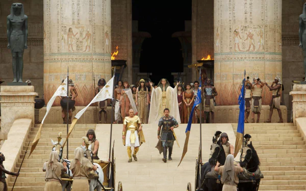 HD PC desktop wallpaper featuring a grand scene from the movie Exodus: Gods and Kings, showcasing ancient Egyptian architecture and characters in period costumes.