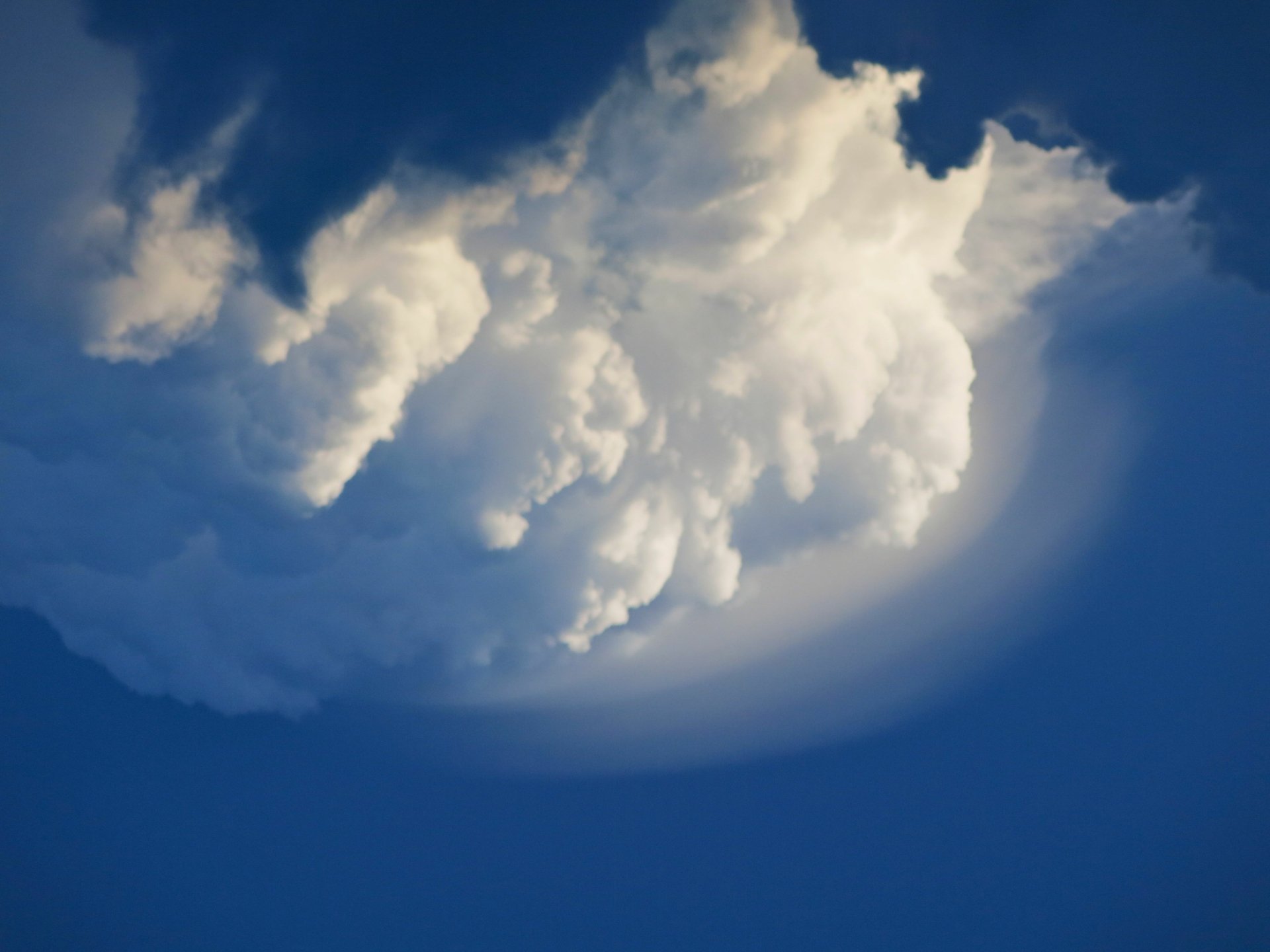 4K Ultra HD desktop wallpaper featuring a vivid blue sky with large, soft white clouds, capturing the serene beauty of nature.
