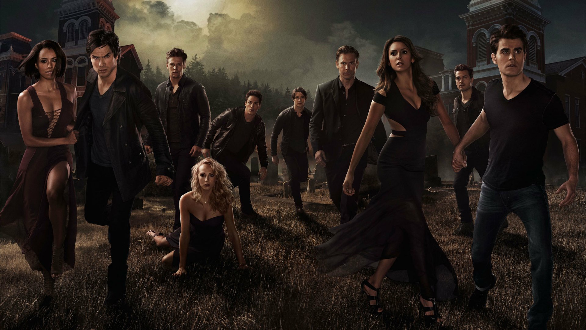 High-definition wallpaper featuring characters from the TV show The Vampire Diaries, set against a dramatic backdrop of a dark landscape and eerie sky.