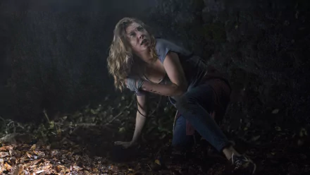 Natalie Dormer in a dark, tense scene from the movie The Forest, captured in 4K Ultra HD as a PC desktop wallpaper and background.