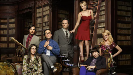 A vibrant HD wallpaper featuring the main cast of *The Big Bang Theory*, including Sheldon, Leonard, Penny, and Amy, posed in a cozy library setting.