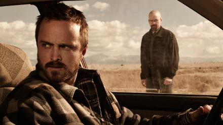 HD desktop wallpaper featuring Jesse Pinkman (Aaron Paul) inside a car and Walter White (Bryan Cranston) standing outside in a desert scene from the TV show Breaking Bad.