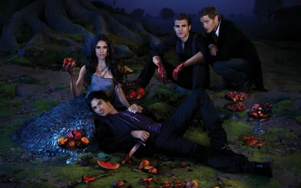 A dramatic scene from The Vampire Diaries, featuring four characters posed amidst dark surroundings with fruit, creating an intense atmosphere in this HD desktop wallpaper.