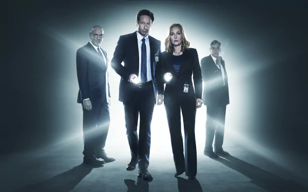 4K Ultra HD PC desktop wallpaper featuring the main cast of The X-Files TV show, standing with flashlights in a dark, foggy environment.