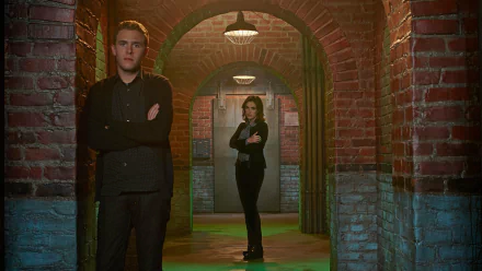 HD PC desktop wallpaper featuring Agents of S.H.I.E.L.D. characters standing in a brick-arched corridor with serious expressions, highlighting the show's intense atmosphere.