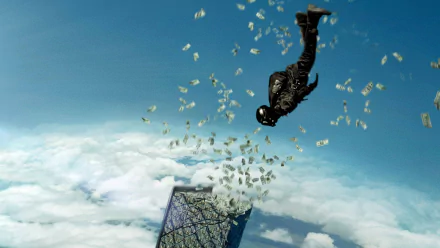 HD desktop wallpaper from the movie Point Break (2015) showing a skydiver falling with money scattered in the air against a cloudy blue sky.