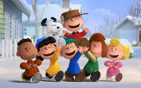 A cheerful group of beloved characters from The Peanuts Movie poses in a snowy landscape, with Charlie Brown and Snoopy front and center, capturing the spirit of friendship and fun.