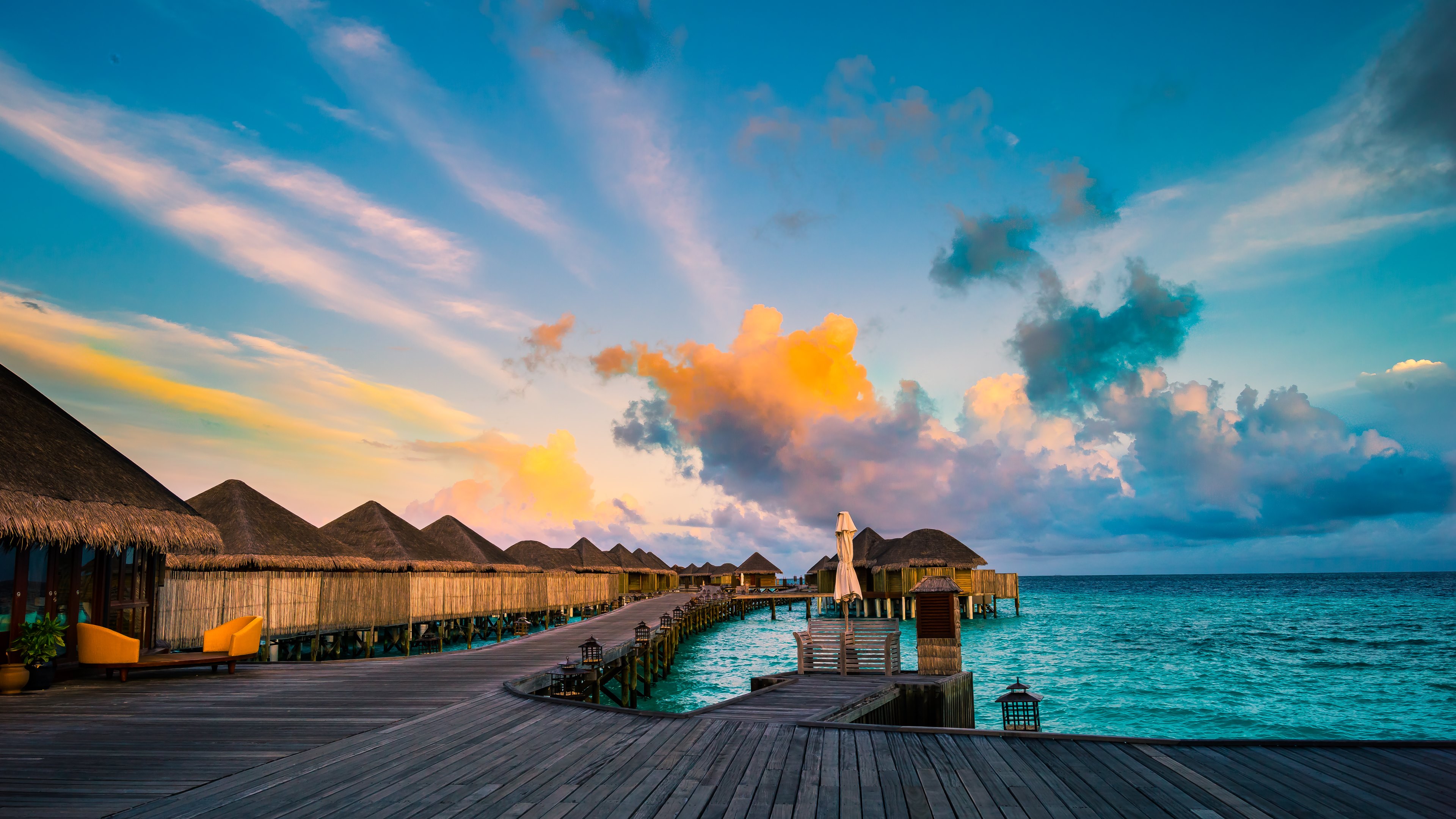 Maldives water villas under palm tree leaves, white sand, blue sea view.  Sunny blue sky, tropical island coast landscape, exotic summer holiday.  Beach vacation template, vertical wallpaper 8316083 Stock Photo at Vecteezy