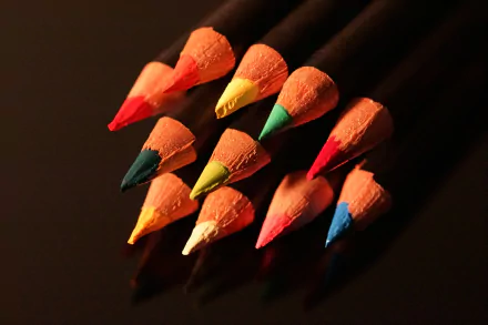 Close-up macro photography of colorful pencil tips arranged in a pattern, captured in 4K Ultra HD quality for a vibrant PC desktop wallpaper.