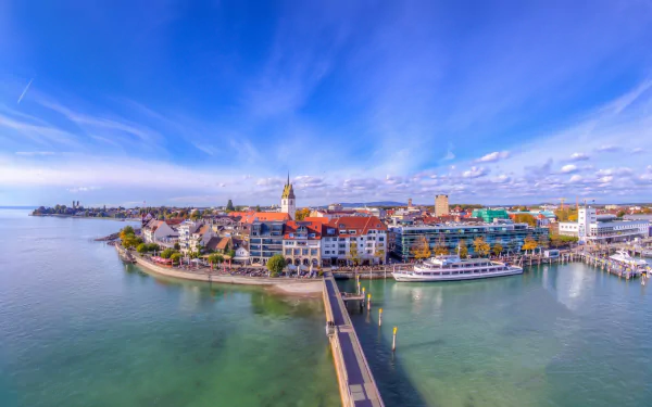 HD cityscape of a vibrant lakeside town on Lake Constance, Baden-Württemberg, Germany, showcasing colorful buildings and a calm waterfront.