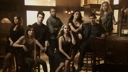 A dynamic group portrait featuring Danielle Campbell and Daniella Pineda among the cast of the TV show The Originals, capturing the essence of their characters in a stylish, HD wallpaper.