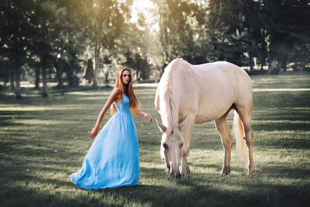 A brunette woman in a blue dress stands beside a white horse in a sunny, bokeh-filled outdoor setting. This HD wallpaper exudes a serene, natural ambiance.