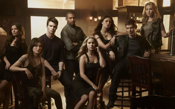 A dynamic group portrait featuring Danielle Campbell and Daniella Pineda among the cast of the TV show The Originals, capturing the essence of their characters in a stylish, HD wallpaper.
