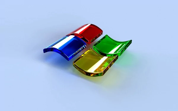 HD desktop wallpaper featuring a 3D Microsoft Windows logo with vibrant red, green, blue, and yellow colors on a light blue background.