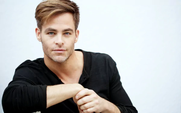 Portrait of American actor and celebrity Chris Pine in a relaxed pose, featured in a 4K Ultra HD PC desktop wallpaper and background.