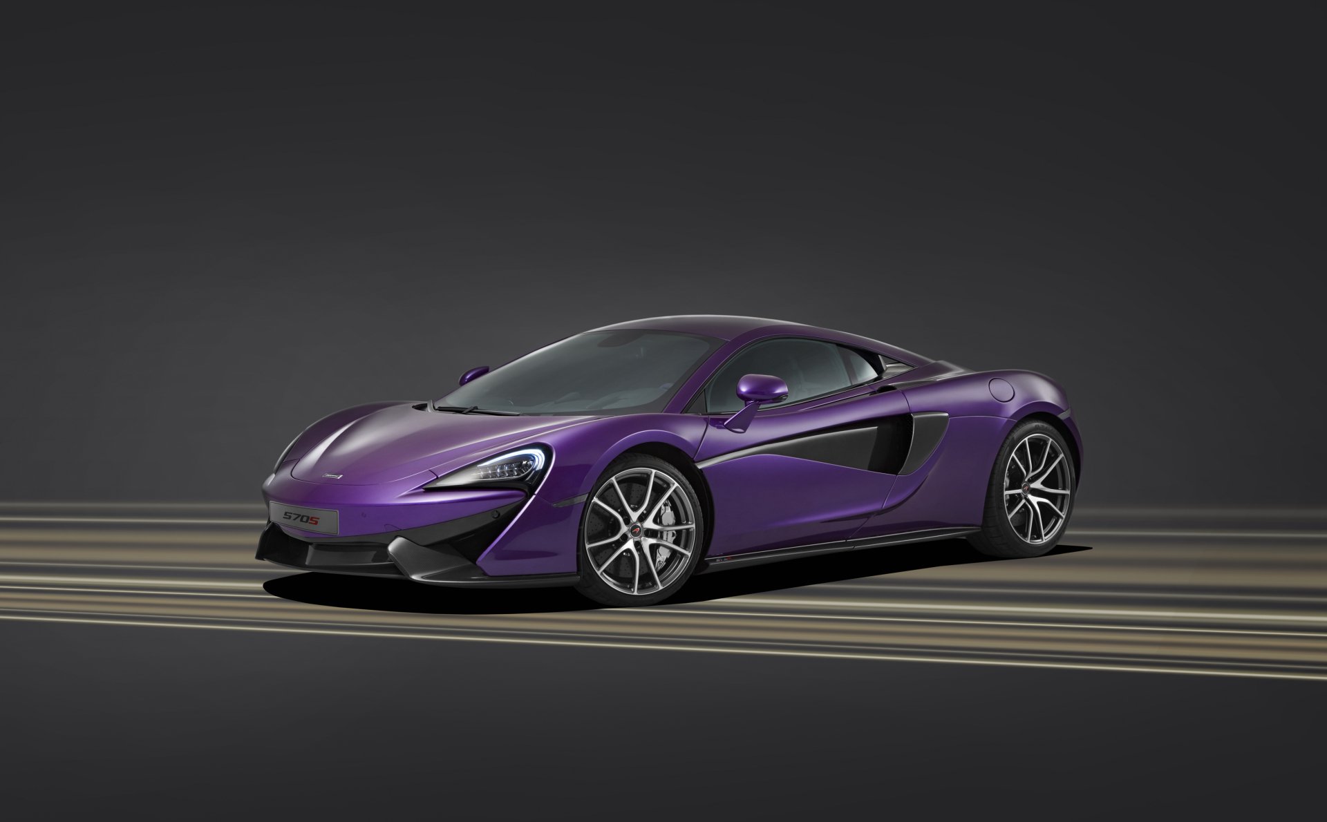 A sleek purple McLaren 570S supercar showcased as a 4K Ultra HD PC desktop wallpaper and background.