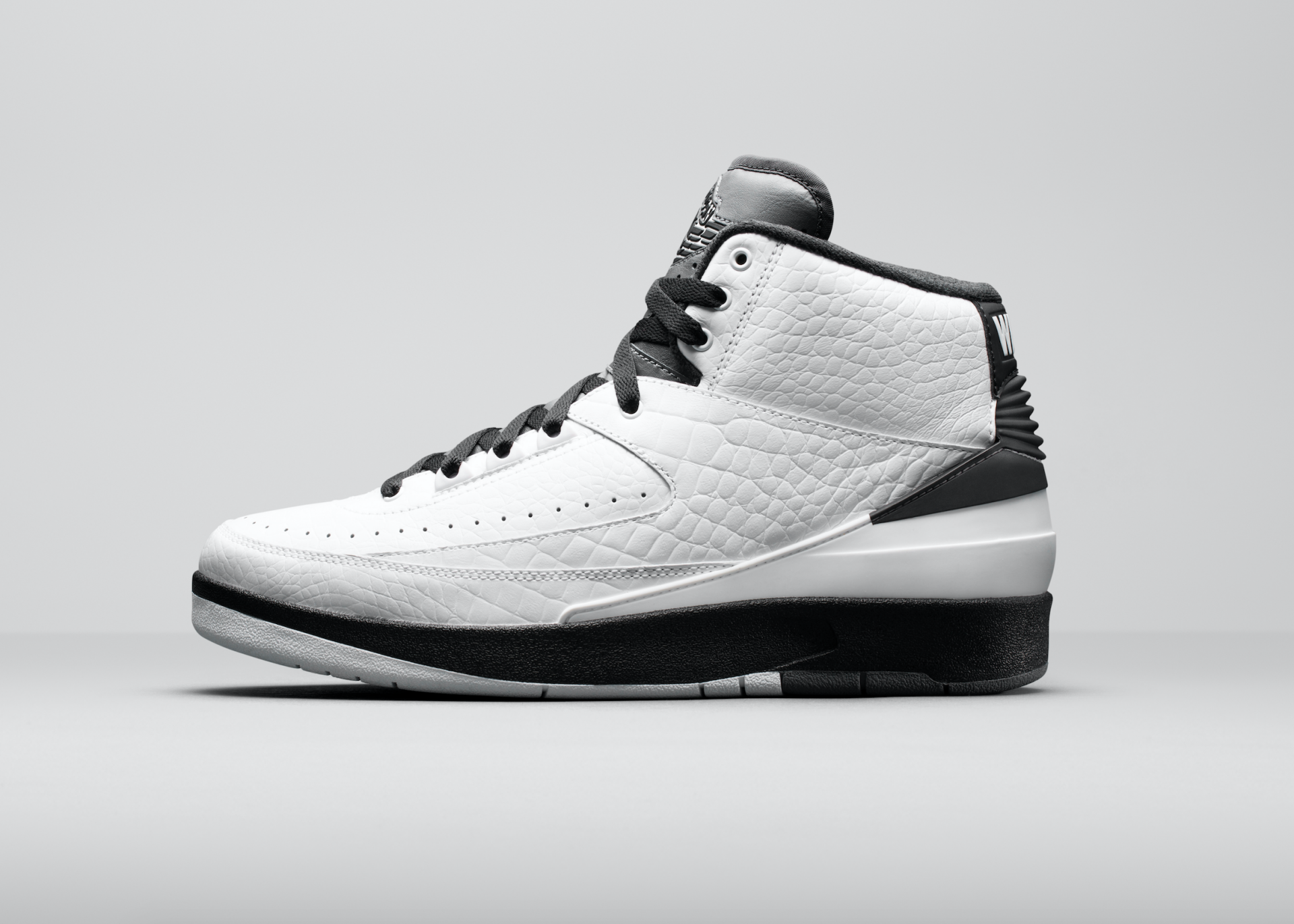 HD desktop wallpaper featuring a white and black Air Jordan shoe against a grey background.