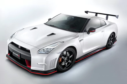 White Nissan GT-R Nismo supercar in three-quarter front view on a light background — 2K Quad HD PC desktop wallpaper of the high-performance vehicle.