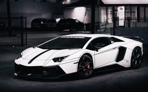 A white Lamborghini Aventador LP 700-4 sports car showcased in a sleek, detailed 4K Ultra HD PC desktop wallpaper background.
