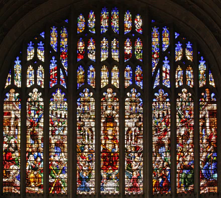 Colorful cathedral church stained-glass window showing religious scenes; high-detail photography as a 2K Quad HD PC desktop wallpaper/background.