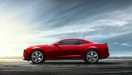 Red Chevrolet Camaro ZL1 muscle car side profile on a wide road under dramatic sky — 2K Quad HD PC desktop wallpaper background