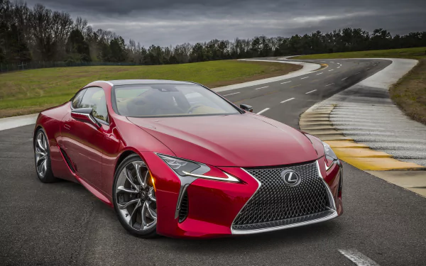 Red Lexus LC 500 sports car on a winding wet racetrack under an overcast sky — Lexus vehicle desktop wallpaper (2K Quad HD PC background).