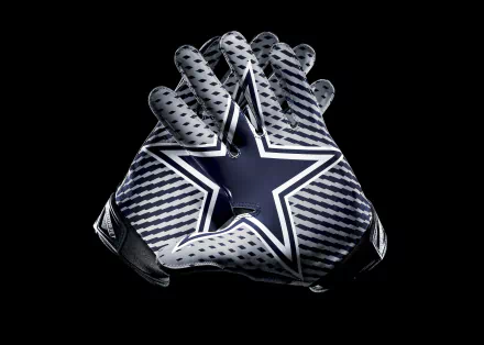 A dynamic close-up of football gloves featuring the iconic Dallas Cowboys star logo, set against a sleek black background. This 4K Ultra HD wallpaper captures the spirit of sports.