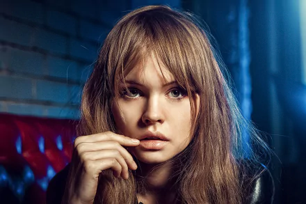HD desktop wallpaper featuring Anastasiya Scheglova, a blonde model, with a thoughtful expression against a dark, moody background.
