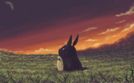 HD desktop wallpaper featuring Totoro from My Neighbor Totoro, sitting in a grassy field at dusk with a dramatic sky.