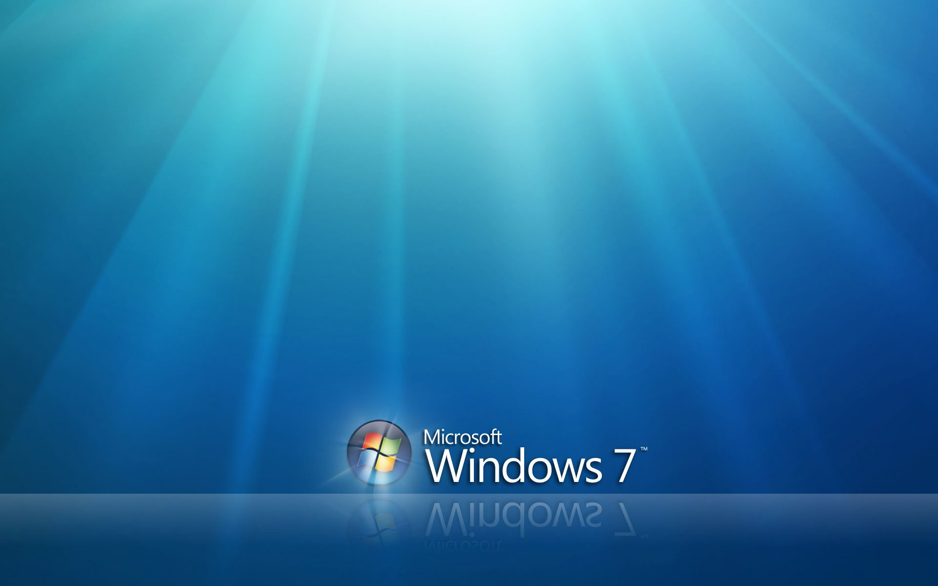 HD desktop wallpaper featuring the Microsoft Windows 7 logo with a radiant blue light background, embodying technology and modern PC aesthetics.