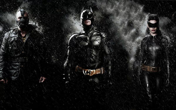 HD desktop wallpaper featuring Catwoman, Batman, and Bane from the DC Comics movie The Dark Knight Rises, set against a dark, smoky background.