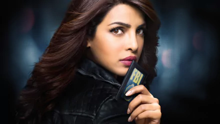 Priyanka Chopra stars in the TV show Quantico, holding an FBI badge in this striking HD wallpaper, showcasing her confident and fierce portrayal of an agent.