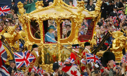  Queen Elizabeth and the Duke of Edinburgh ride in the Golden State Carriage at the head of a parade 