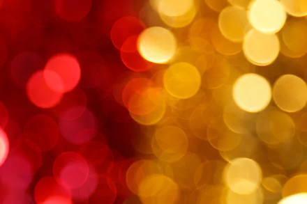Abstract 4K Ultra HD wallpaper featuring artistic red and yellow bokeh circles with a blurred depth of field and vibrant light effects.