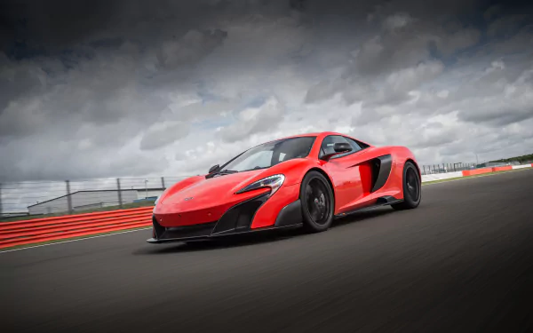 Red McLaren 675LT supercar on a racetrack under dramatic clouds — 4K Ultra HD PC desktop wallpaper/background of a McLaren car and high-performance vehicle.