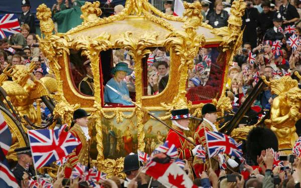  Queen Elizabeth and the Duke of Edinburgh ride in the Golden State Carriage at the head of a parade 