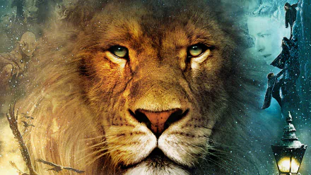 HD desktop wallpaper featuring a close-up of a lion from the movie The Chronicles of Narnia: The Lion, the Witch and the Wardrobe with mystical and icy background elements.