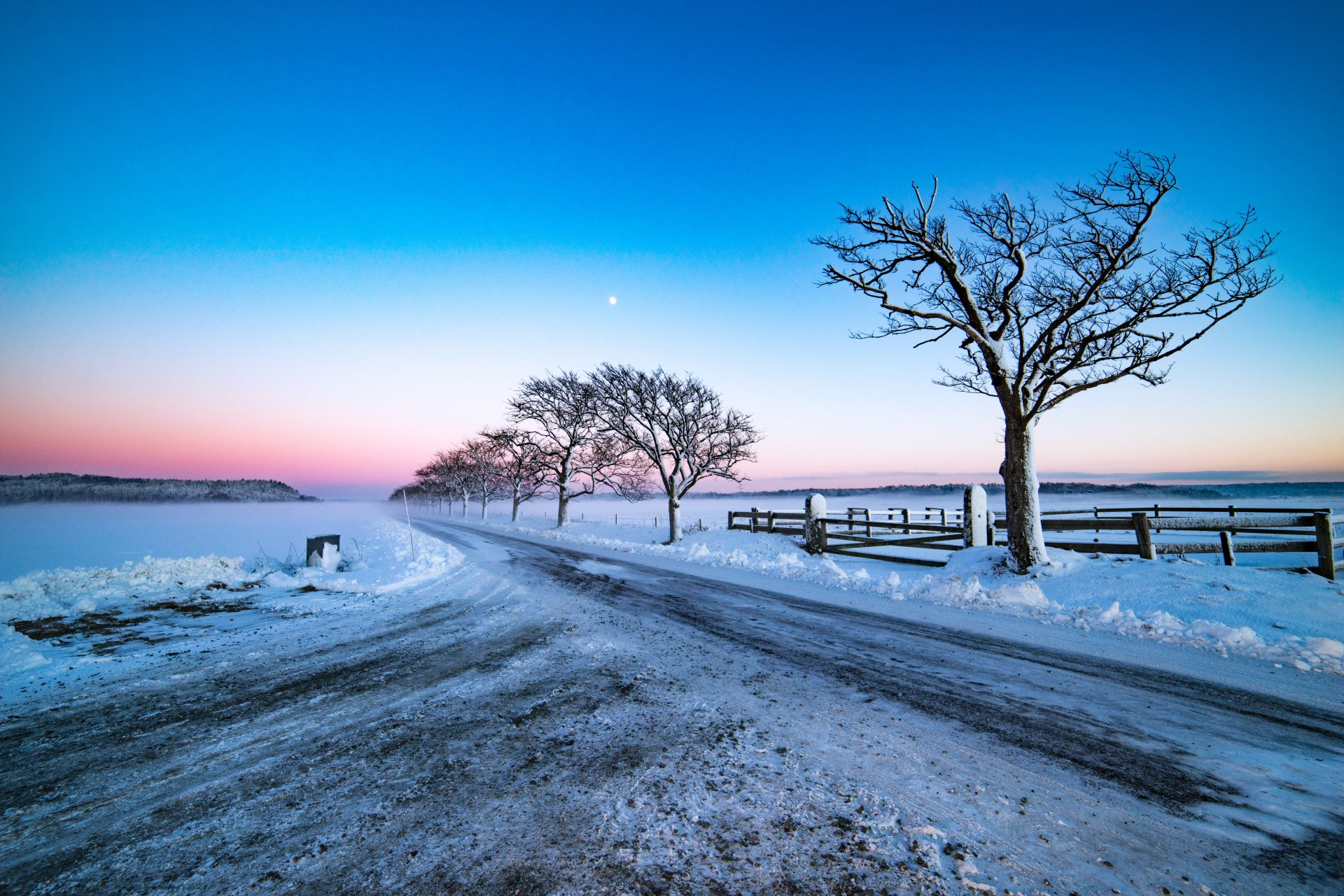 Winter Moonlit Road: Stunning 4K Sunset Snowscape with Fence and Trees ...